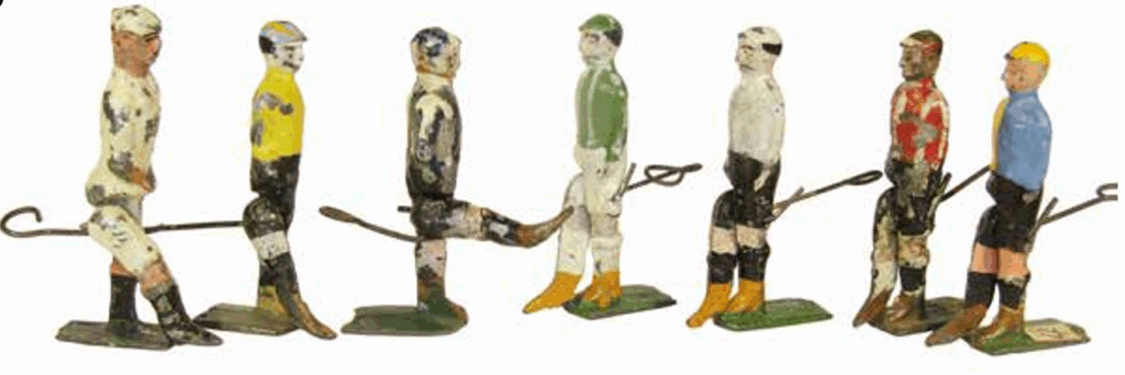 65 mm footballer in white (far left) unknown.