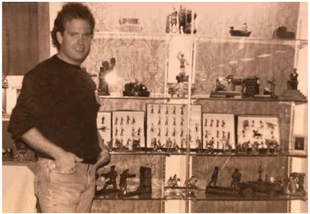 picture of Ray Haradin in front of toy collection